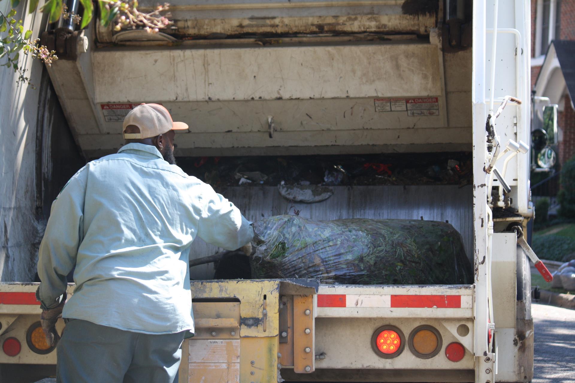 Tyler Solid Waste collecting bagged leaves