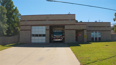 A fire truck parked inside a fire station