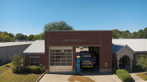 A fire truck parked inside a fire station